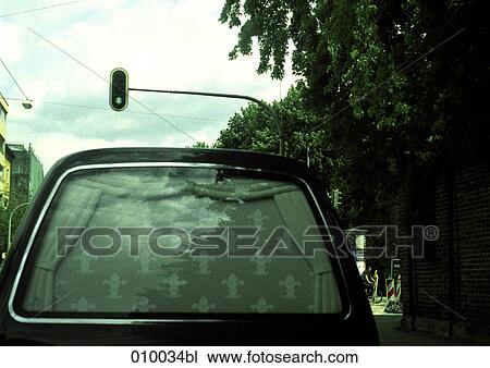 detail rear view of a hearse at green traffic light View Large Photo Image Stock Image - detail rear view of a hearse at green traffic light. Fotosearch