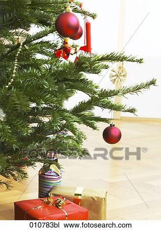 different presents under decorated christmas tree View Large Photo Image Stock Image - different presents under decorated christmas tree. Fotosearch
