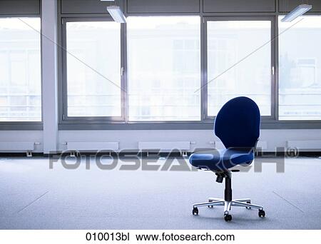 empty office chair in deserted office space View Large Photo Image Stock Image - empty office chair in deserted office space. Fotosearch