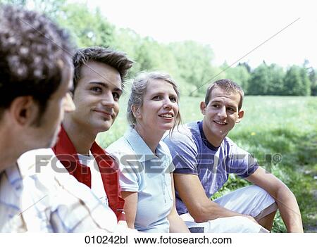 family relaxing in a park during springtime View Large Photo Image Stock Image - family relaxing in a park during springtime. Fotosearch