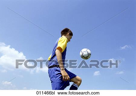 football player juggling the ball View Large Photo Image Stock Image - football player juggling the ball. Fotosearch