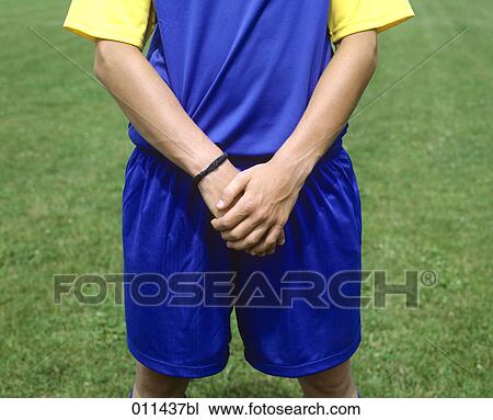 football player protecting his soft parts View Large Photo Image Stock Image - football player protecting his soft parts. Fotosearch