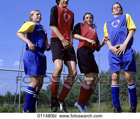 football players jumping to defend free kick View Large Photo Image Stock Image - football players jumping to defend free kick. Fotosearch