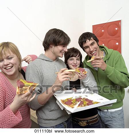Four teenagers eating pizza View Large Photo Image Stock Image - Four teenagers eating pizza. Fotosearch