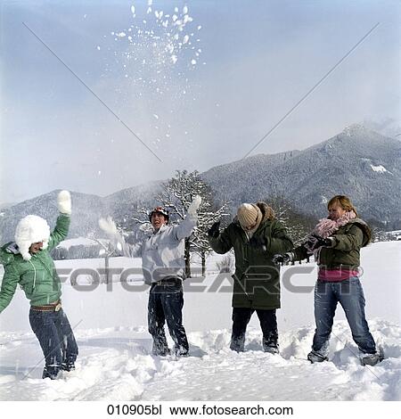 four teenagers playing in the snow View Large Photo Image Stock Image - four teenagers playing in the snow. Fotosearch