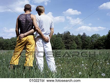 gay couple (20-25 years) holding hands, view from behind View Large Photo Image Stock Image - gay couple (20-25 years) holding hands, view from behind. Fotosearch