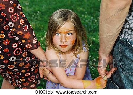 girl holding parents´ hands looking into camera View Large Photo Image Stock Image - girl holding parents´ hands looking into camera. Fotosearch