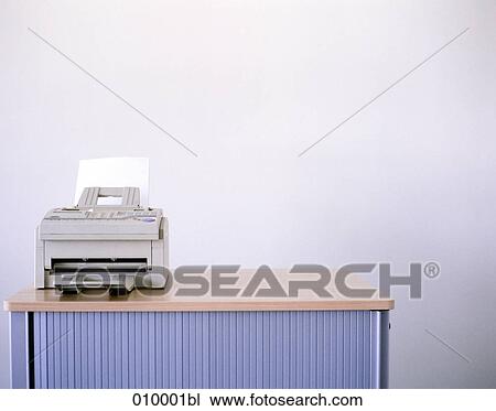 grey faxmachine on horizontal office sideboard, white background View Large Photo Image Stock Image - grey faxmachine on horizontal office sideboard, white background. Fotosearch