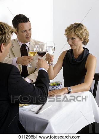 group of business people toasting at lunch View Large Photo Image Stock Image - group of business people toasting at lunch. Fotosearch