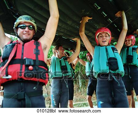 group of young people getting ready for river rafting View Large Photo Image Stock Image - group of young people getting ready for river rafting. Fotosearch