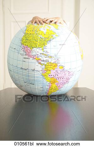 hands holding an inflatable globe View Large Photo Image Stock Image - hands holding an inflatable globe. Fotosearch