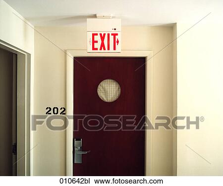 hotel room door and exitsign hanging on the ceiling View Large Photo Image Stock Image - hotel room door and exitsign hanging on the ceiling. Fotosearch
