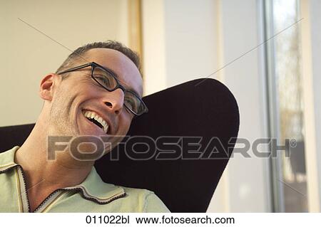 Laughing young man View Large Photo Image Stock Image - Laughing young man. Fotosearch