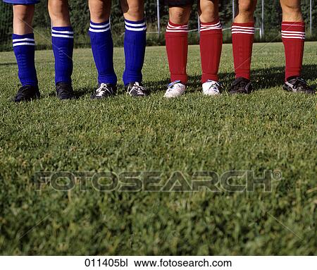Stock Image - legs of football players in close-up. Fotosearch