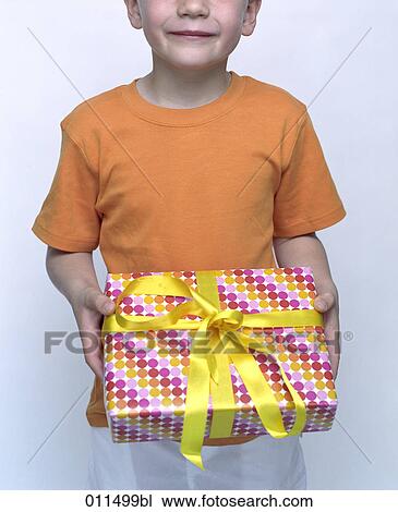 little boy with colorfully wrapped box in his hands View Large Photo Image Stock Image - little boy with colorfully wrapped box in his hands. Fotosearch