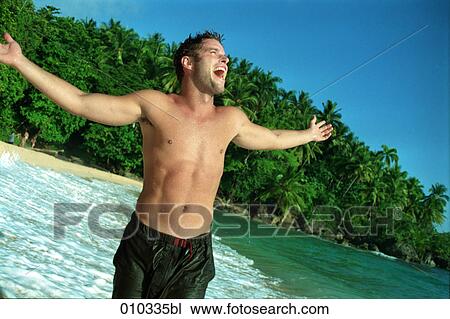 male caucasian (30-35 years) happy and joyful at the beach View Large Photo Image Stock Image - male caucasian (30-35 years) happy and joyful at the beach. Fotosearch