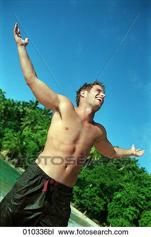 male caucasian (30-35 years) happy and joyful at the beach View Large Photo Image Stock Image - male caucasian (30-35 years) happy and joyful at the beach. Fotosearch