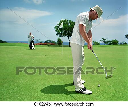 man (30-35 years) on golf course View Large Photo Image Stock Image - man (30-35 years) on golf course . Fotosearch