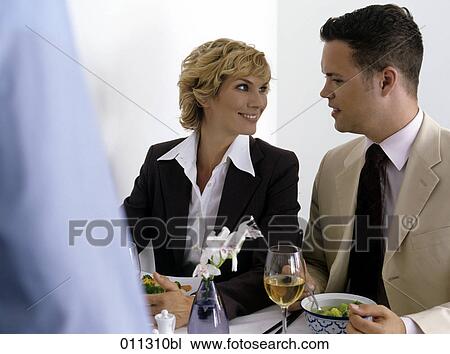 man and woman talking at business lunch View Large Photo Image Stock Image - man and woman talking at business lunch. Fotosearch
