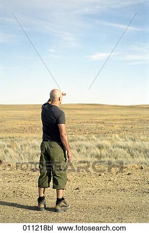 man looking into the distance View Large Photo Image Stock Image - man looking into the distance. Fotosearch