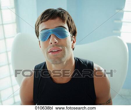 man wearing a gelmask over his eyes View Large Photo Image Stock Image - man wearing a gelmask over his eyes. Fotosearch