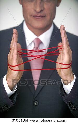 mature businessman doing the cat´s cradle with a red woolen thread View Large Photo Image Stock Image - mature businessman doing the cat´s cradle with a red woolen thread. Fotosearch