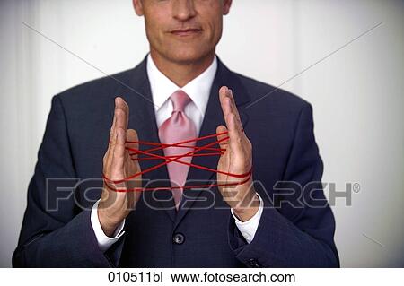 mature businessman doing the cat´s cradle with a red woolen thread View Large Photo Image Stock Image - mature businessman doing the cat´s cradle with a red woolen thread. Fotosearch