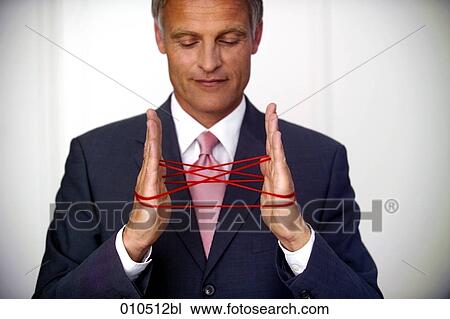 mature businessman doing the cat´s cradle with a red woolen thread View Large Photo Image Stock Image - mature businessman doing the cat´s cradle with a red woolen thread. Fotosearch