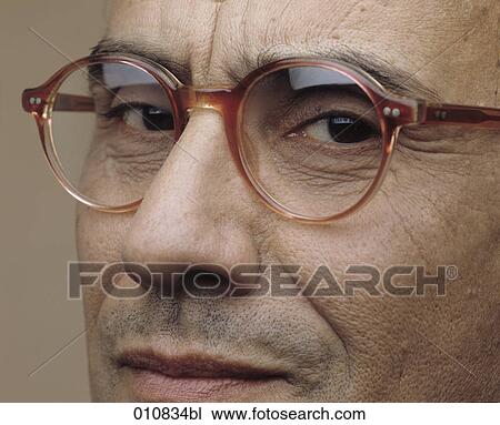 Mature man with horn-rimmed glasses looking into the camera View Large Photo Image Stock Image - Mature man with horn-rimmed glasses looking into the camera. Fotosearch