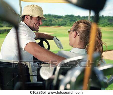 models posing in electric caddy on golf course View Large Photo Image Stock Image - models posing in electric caddy on golf course. Fotosearch