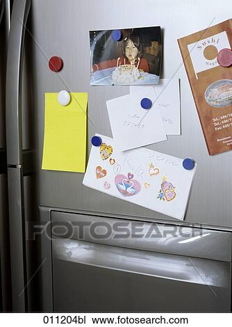notes and photographs on refrigerator door View Large Photo Image Stock Image - notes and photographs on refrigerator door. Fotosearch