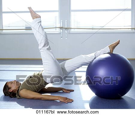 Pilates training performed by woman in gym View Large Photo Image Stock Image - Pilates training performed by woman in gym. Fotosearch