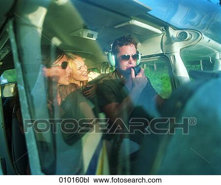 pilot in small propeller plane talking to female passengers View Large Photo Image Stock Image - pilot in small propeller plane talking to female passengers. Fotosearch