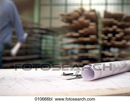 plans and a pair of compasses lying on a table in a joinery View Large Photo Image Stock Image - plans and a pair of compasses lying on a table in a joinery. Fotosearch