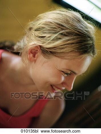 Stock Image - portrait of blonde, smiling teenage girl. Fotosearch