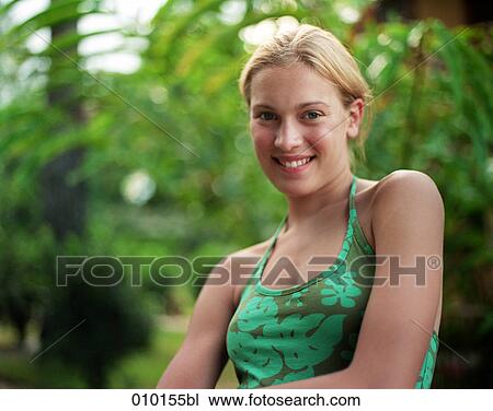 Stock Image - portrait of blonde, smiling teenage woman. Fotosearch