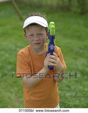 portrait of boy with water pistol View Large Photo Image Stock Image - portrait of boy with water pistol. Fotosearch