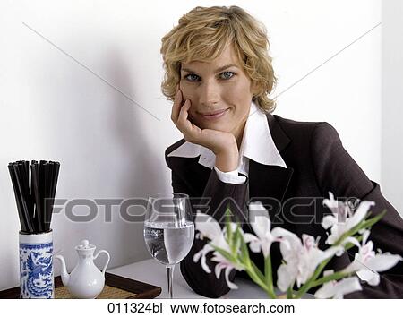 portrait of businesswoman sitting in an asian restaurant View Large Photo Image Stock Image - portrait of businesswoman sitting in an asian restaurant. Fotosearch