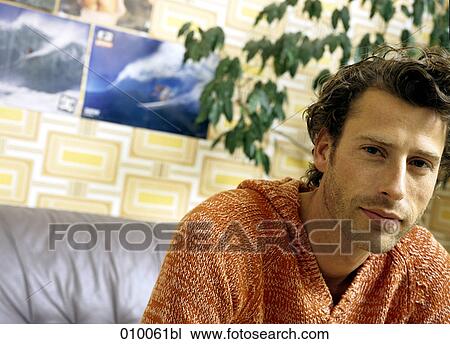 portrait of caucasian male on grey leather sofa View Large Photo Image Stock Image - portrait of caucasian male on grey leather sofa. Fotosearch