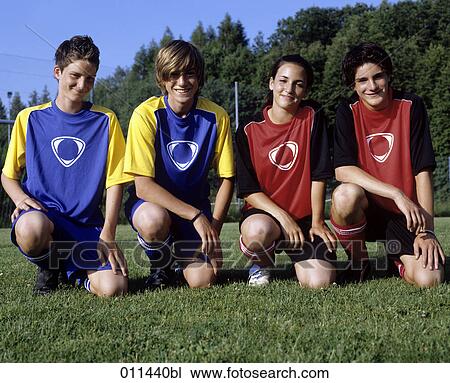 portrait of four teenage football players View Large Photo Image Stock Image - portrait of four teenage football players. Fotosearch
