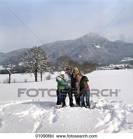 Stock Image - portrait of four teenagers on a day out in the snow. Fotosearch