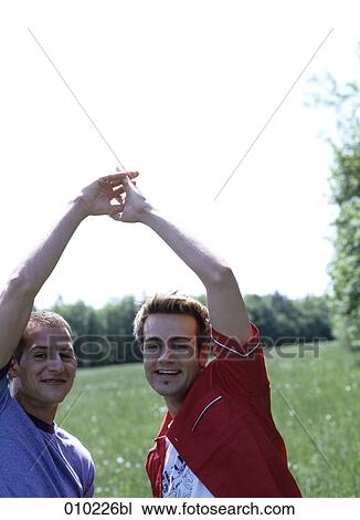 portrait of gay couple (20-25 years) enyoing each others company View Large Photo Image Stock Image - portrait of gay couple (20-25 years) enyoing each others company. Fotosearch