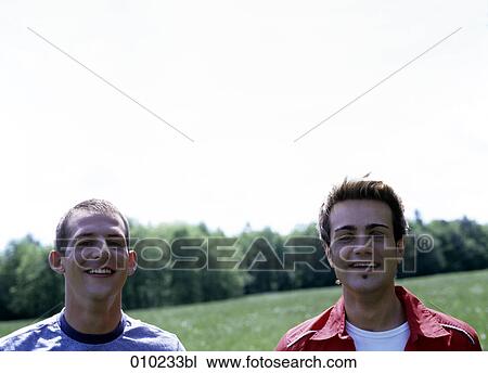 portrait of gay couple (20-25 years) outdoors looking at camera View Large Photo Image Stock Image - portrait of gay couple (20-25 years) outdoors looking at camera. Fotosearch