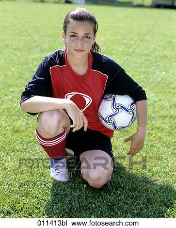portrait of kneeling teenage girl in football dress View Large Photo Image Stock Image - portrait of kneeling teenage girl in football dress. Fotosearch
