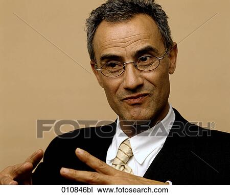 Portrait of mature businessman wearing suit and tie View Large Photo Image Stock Image - Portrait of mature businessman wearing suit and tie. Fotosearch