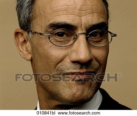 Portrait of mature businessman with spectacles View Large Photo Image Stock Image - Portrait of mature businessman with spectacles. Fotosearch