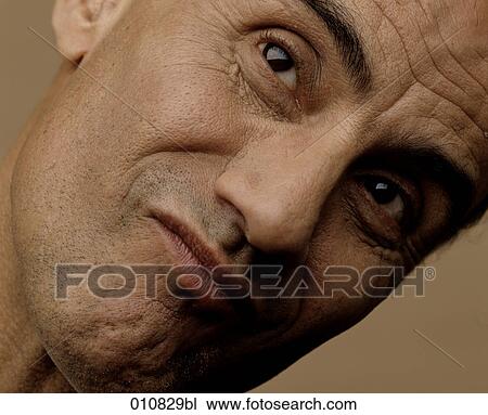 Portrait of mature man with sceptical expression View Large Photo Image Stock Image - Portrait of mature man with sceptical expression. Fotosearch