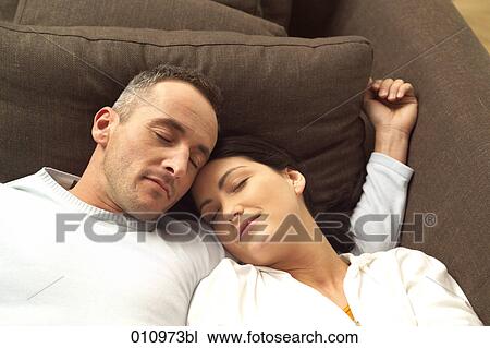 Portrait of sleeping couple on sofa View Large Photo Image Stock Image - Portrait of sleeping couple on sofa. Fotosearch