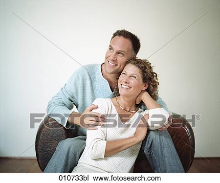 portrait of smiling couple in casual outfit View Large Photo Image Stock Image - portrait of smiling couple in casual outfit. Fotosearch