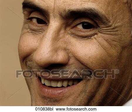 Stock Image - Portrait of smiling elderly man. Fotosearch